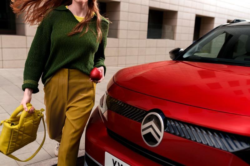 woman_beside_red_citroen_car.jpg
