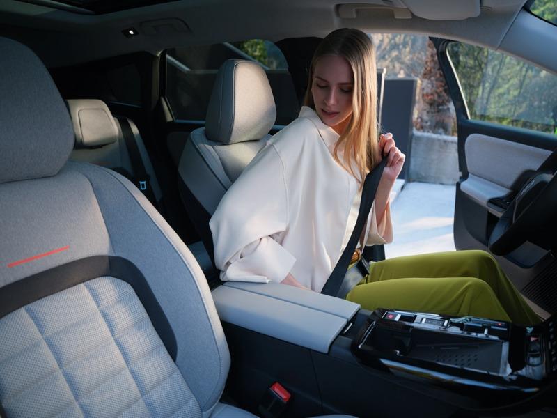 woman_fastening_seatbelt_car_interior.jpg