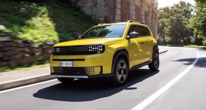yellow_fiat_suv_driving_road.jpg